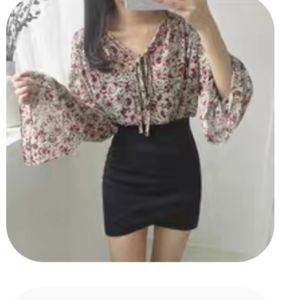 Black asymmetrical pencil skirt